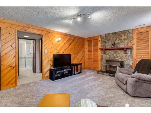 243 Silver Brook Way Nw, Calgary, AB - Indoor Photo Showing Living Room With Fireplace