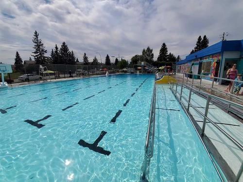 243 Silver Brook Way Nw, Calgary, AB - Outdoor With In Ground Pool