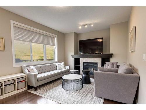 114 Sherwood Mount Nw, Calgary, AB - Indoor Photo Showing Living Room With Fireplace