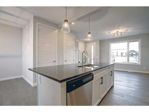 332 Waterford Boulevard, Chestermere, AB - Indoor Photo Showing Kitchen With Upgraded Kitchen