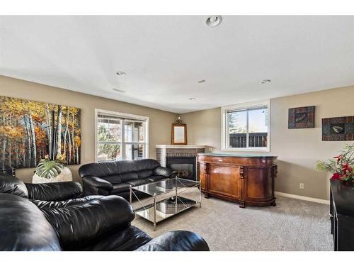 69 Evansbrooke Park Nw, Calgary, AB - Indoor Photo Showing Living Room With Fireplace