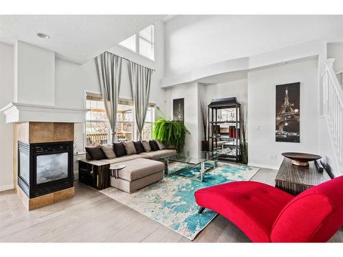 69 Evansbrooke Park Nw, Calgary, AB - Indoor Photo Showing Living Room With Fireplace