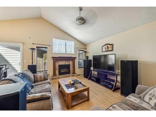 90 Cranberry Close Se, Calgary, AB - Indoor Photo Showing Living Room With Fireplace