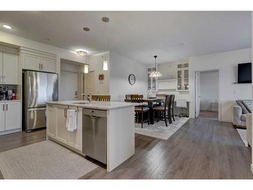 409-6603 New Brighton Avenue Se, Calgary, AB - Indoor Photo Showing Kitchen With Stainless Steel Kitchen With Upgraded Kitchen