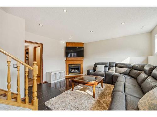 16270 Shawbrooke Drive Sw, Calgary, AB - Indoor Photo Showing Living Room With Fireplace