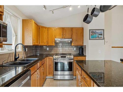 16270 Shawbrooke Drive Sw, Calgary, AB - Indoor Photo Showing Kitchen With Stainless Steel Kitchen With Double Sink