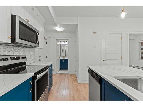 101-19621 40 Street Se, Calgary, AB - Indoor Photo Showing Kitchen With Stainless Steel Kitchen