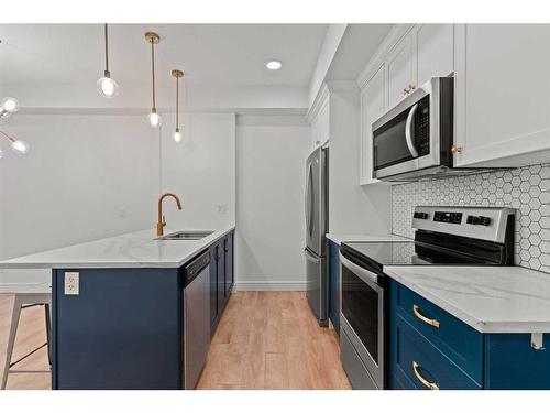 101-19621 40 Street Se, Calgary, AB - Indoor Photo Showing Kitchen With Stainless Steel Kitchen With Upgraded Kitchen