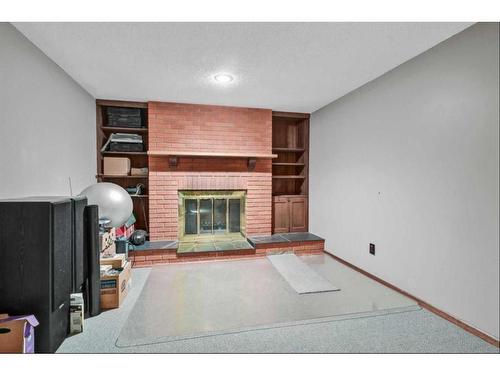 4228 Voyageur Drive Nw, Calgary, AB - Indoor With Fireplace