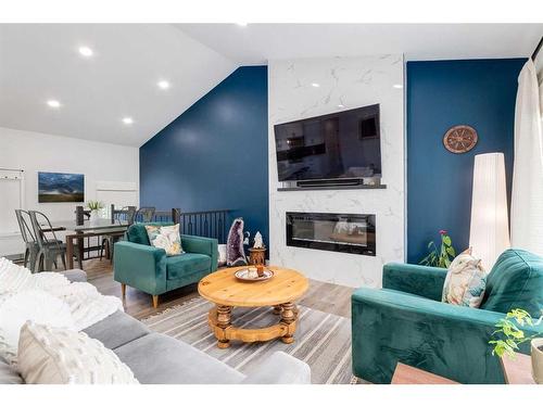 4944 45 Street Sw, Calgary, AB - Indoor Photo Showing Living Room With Fireplace