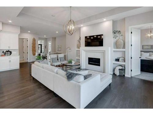 2205 Bayside Road Sw, Airdrie, AB - Indoor Photo Showing Living Room With Fireplace