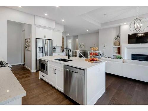 2205 Bayside Road Sw, Airdrie, AB - Indoor Photo Showing Kitchen With Fireplace With Double Sink With Upgraded Kitchen