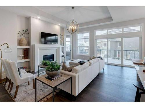 2205 Bayside Road Sw, Airdrie, AB - Indoor Photo Showing Living Room With Fireplace