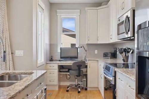 42 Nolanfield Heights Nw, Calgary, AB - Indoor Photo Showing Kitchen With Double Sink