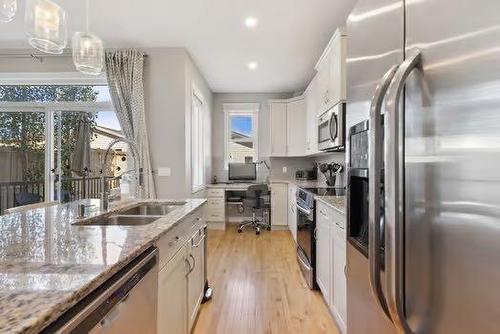 42 Nolanfield Heights Nw, Calgary, AB - Indoor Photo Showing Kitchen With Stainless Steel Kitchen With Double Sink With Upgraded Kitchen