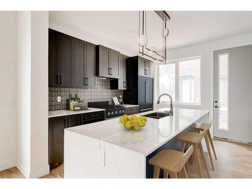 Unit C-2220 26 Avenue Sw, Calgary, AB - Indoor Photo Showing Kitchen With Double Sink With Upgraded Kitchen