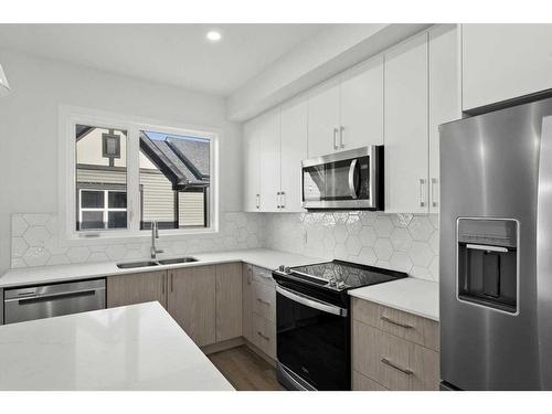 306-75 Evanscrest Common Nw, Calgary, AB - Indoor Photo Showing Kitchen With Double Sink With Upgraded Kitchen