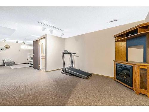 1 Hunters Crescent, Okotoks, AB - Indoor Photo Showing Gym Room