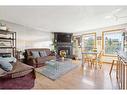 215 Shawcliffe Circle Sw, Calgary, AB  - Indoor Photo Showing Living Room With Fireplace 