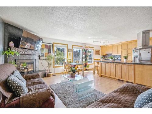 215 Shawcliffe Circle Sw, Calgary, AB - Indoor Photo Showing Living Room With Fireplace