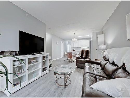 205-400 1 Avenue Se, Diamond Valley, AB - Indoor Photo Showing Living Room