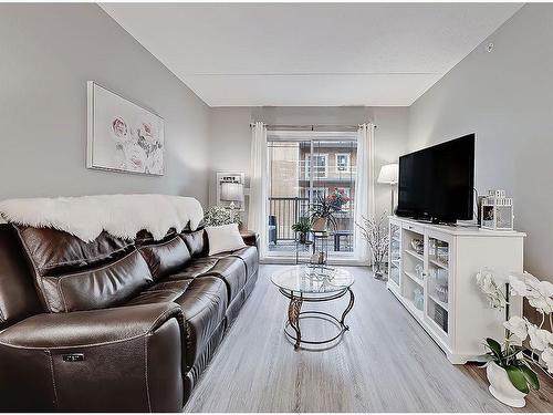 205-400 1 Avenue Se, Diamond Valley, AB - Indoor Photo Showing Living Room