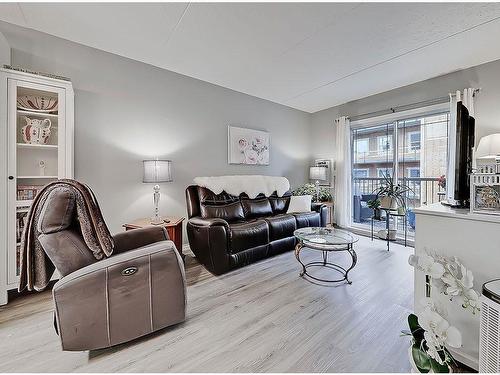 205-400 1 Avenue Se, Diamond Valley, AB - Indoor Photo Showing Living Room