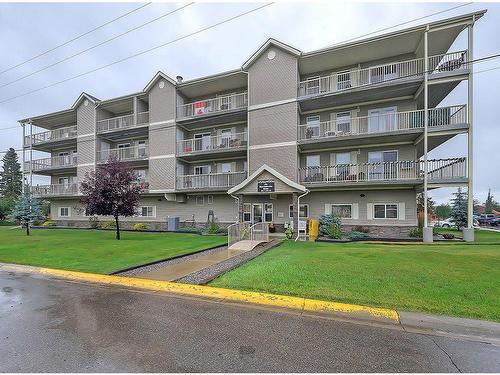 205-400 1 Avenue Se, Diamond Valley, AB - Outdoor With Balcony With Facade