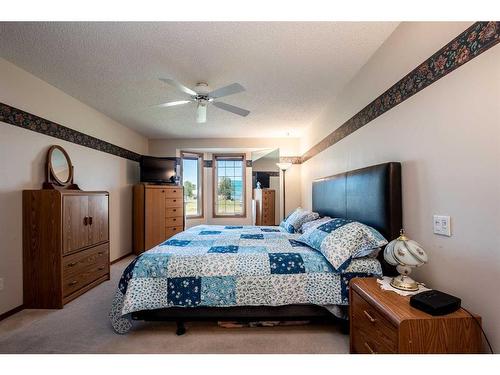 901 Riverside Drive Nw, High River, AB - Indoor Photo Showing Bedroom