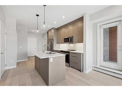 2203-395 Skyview Parkway Ne, Calgary, AB - Indoor Photo Showing Kitchen With Stainless Steel Kitchen With Double Sink With Upgraded Kitchen