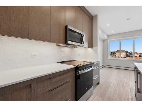 2203-395 Skyview Parkway Ne, Calgary, AB - Indoor Photo Showing Kitchen With Upgraded Kitchen