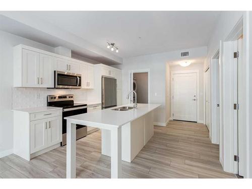 115-500 Auburn Meadows Common Se, Calgary, AB - Indoor Photo Showing Kitchen With Upgraded Kitchen