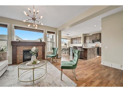 654 Marina Drive, Chestermere, AB - Indoor Photo Showing Living Room With Fireplace