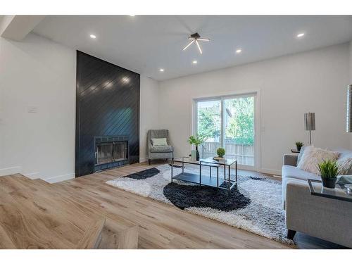 2306 19 Street Ne, Calgary, AB - Indoor Photo Showing Living Room With Fireplace