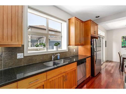 202-1312 Russel Road Ne, Calgary, AB - Indoor Photo Showing Kitchen With Double Sink