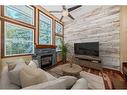 242 Benchlands Terrace, Canmore, AB  - Indoor Photo Showing Living Room With Fireplace 