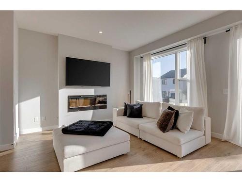 20 Rowley Terrace Nw, Calgary, AB - Indoor Photo Showing Living Room With Fireplace