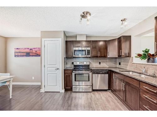 47 Panatella Road Nw, Calgary, AB - Indoor Photo Showing Kitchen With Stainless Steel Kitchen