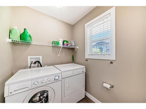 47 Panatella Road Nw, Calgary, AB - Indoor Photo Showing Laundry Room