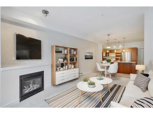 115-3600 15A Street Sw, Calgary, AB - Indoor Photo Showing Living Room With Fireplace