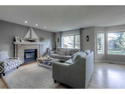 355 Mt Sparrowhawk Place Se, Calgary, AB - Indoor Photo Showing Living Room With Fireplace