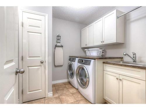 355 Mt Sparrowhawk Place Se, Calgary, AB - Indoor Photo Showing Laundry Room