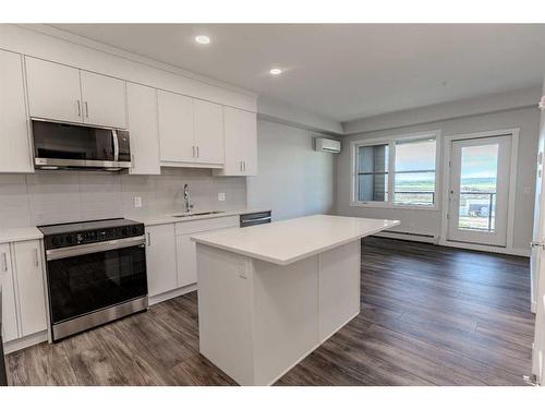 311-125 Wolf Hollow Crescent Se, Calgary, AB - Indoor Photo Showing Kitchen With Upgraded Kitchen