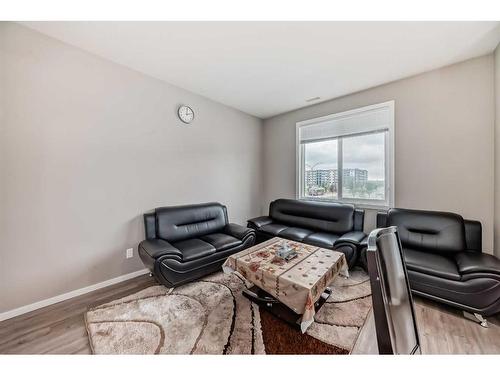 202-515 Redstone Walk Ne, Calgary, AB - Indoor Photo Showing Living Room