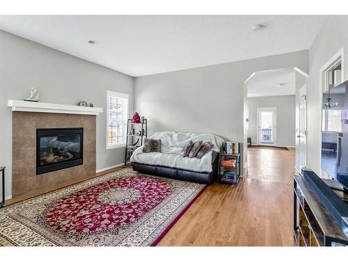 96 Elgin View Se, Calgary, AB - Indoor Photo Showing Living Room With Fireplace