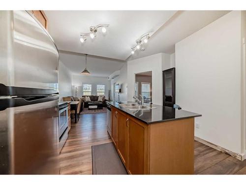 1410-11811 Lake Fraser Drive Se, Calgary, AB - Indoor Photo Showing Kitchen With Double Sink