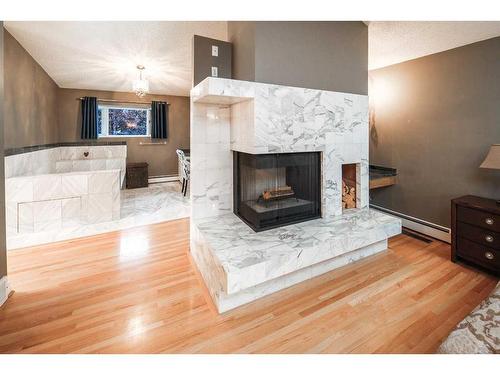 1154 Varsity Estates Drive Nw, Calgary, AB - Indoor Photo Showing Living Room With Fireplace