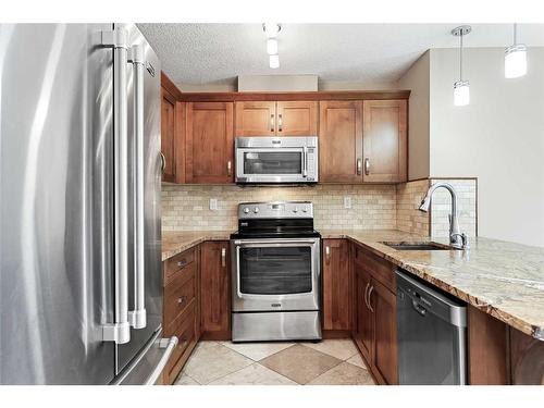 1106-450 Sage Valley Drive Nw, Calgary, AB - Indoor Photo Showing Kitchen With Stainless Steel Kitchen With Upgraded Kitchen