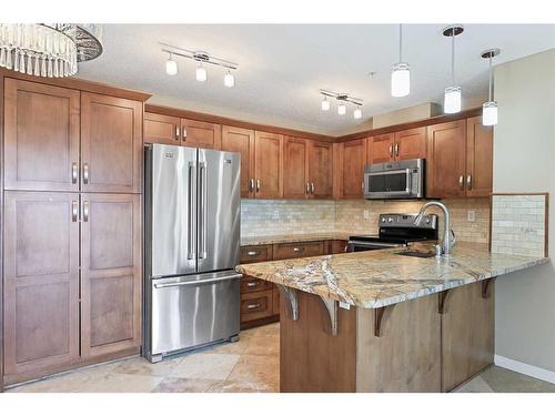 1106-450 Sage Valley Drive Nw, Calgary, AB - Indoor Photo Showing Kitchen With Stainless Steel Kitchen With Double Sink