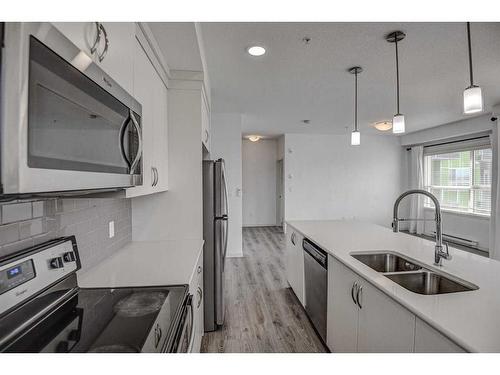 326-20 Seton Park Se, Calgary, AB - Indoor Photo Showing Kitchen With Double Sink With Upgraded Kitchen